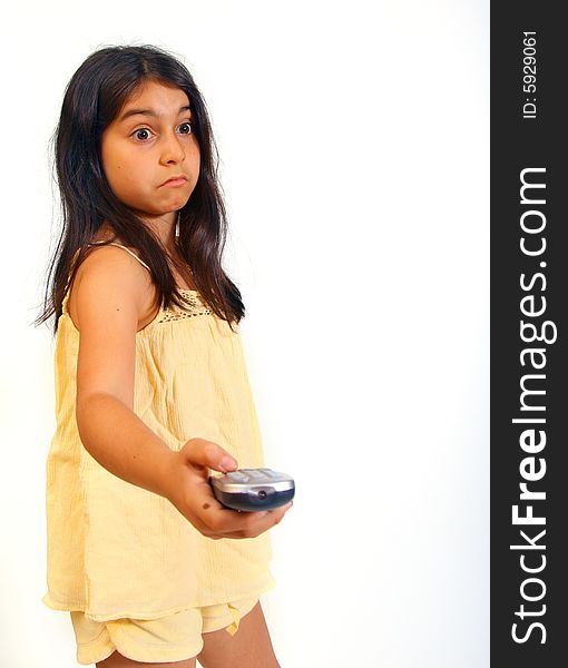 8 year old girl changing tv channel with remote control. 8 year old girl changing tv channel with remote control