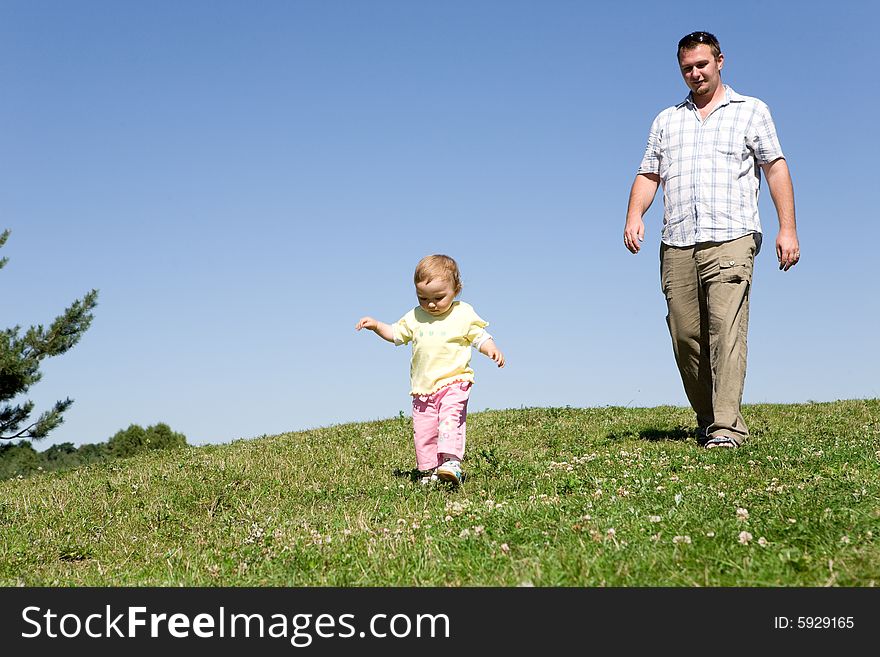 Happy family on green meadow. Happy family on green meadow