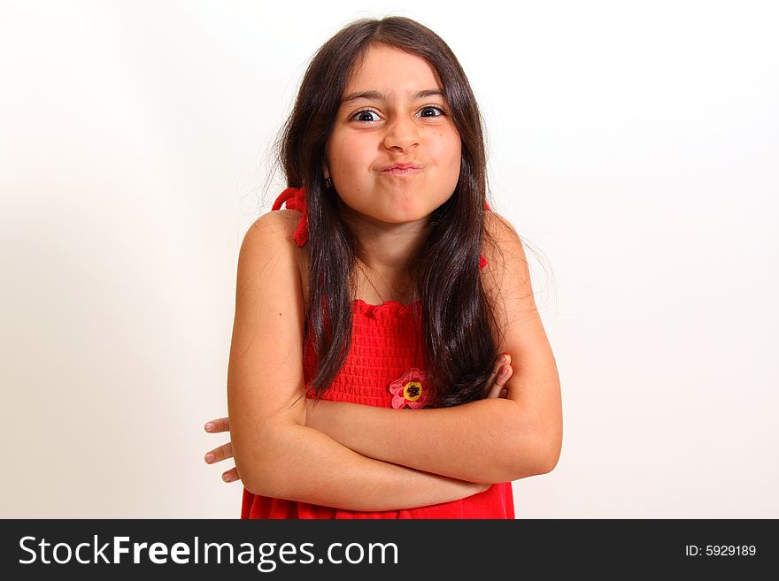 Young emotional girl with arms folded. Young emotional girl with arms folded