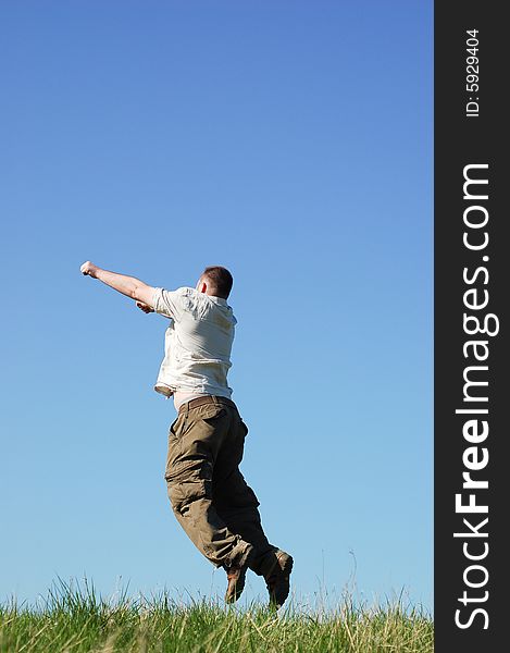 Happy man jumping on sky background. Happy man jumping on sky background