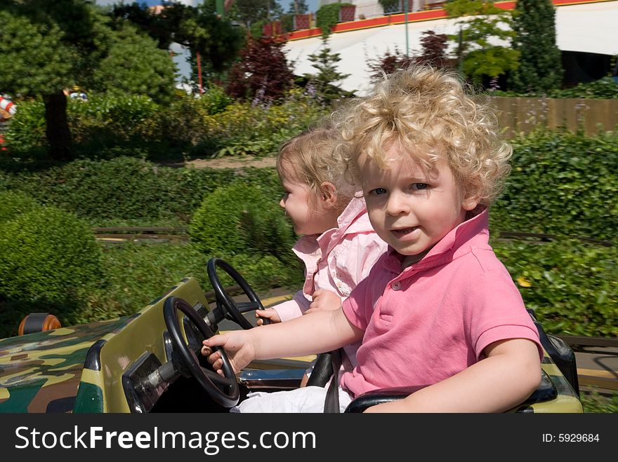 Cute young boy and girl in a car. Cute young boy and girl in a car