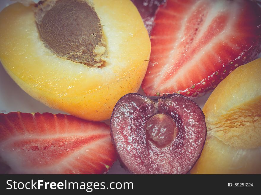 Fresh ripe apricot, cherry and strawberry close up, vintage background. Fresh ripe apricot, cherry and strawberry close up, vintage background.