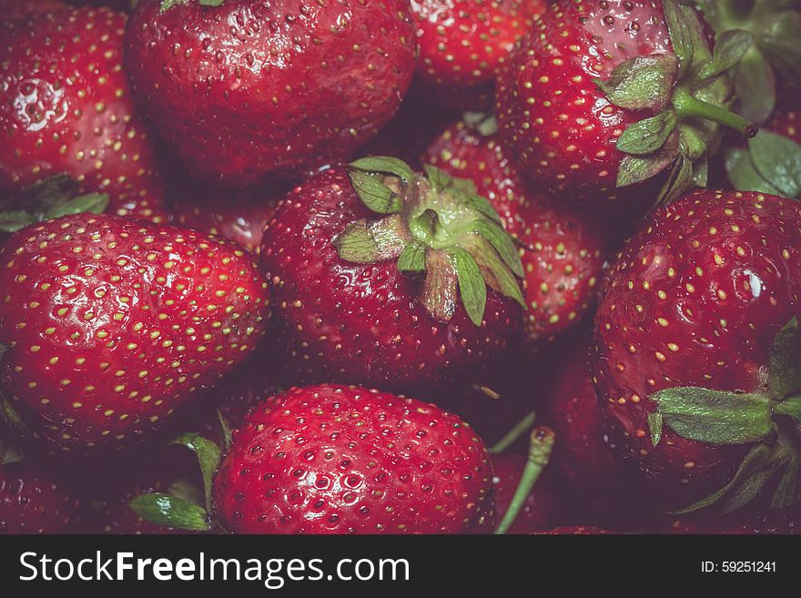 Fresh ripe strawberries background, vintage photo effect. Fresh ripe strawberries background, vintage photo effect.