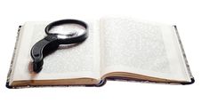 Magnifying Glass On Book Stock Images