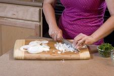 Woman Chopping Onions In Kitchen 1 Stock Photos Woman Chopping Onions In Kitchen 1 Stock Photos