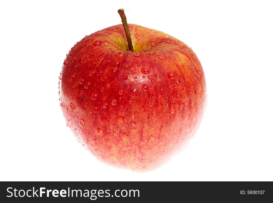 Wet red apple isolated on white background