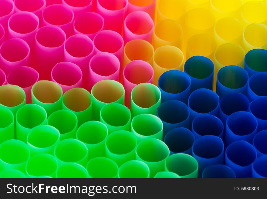 Straw for cocktails as a color background