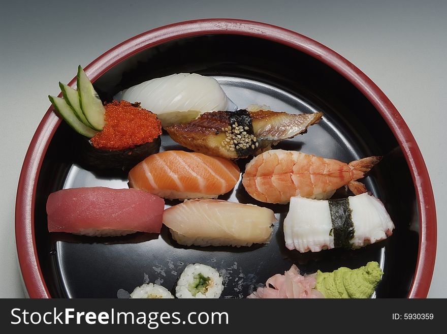 Sushi japanese food on ceramic round plate
