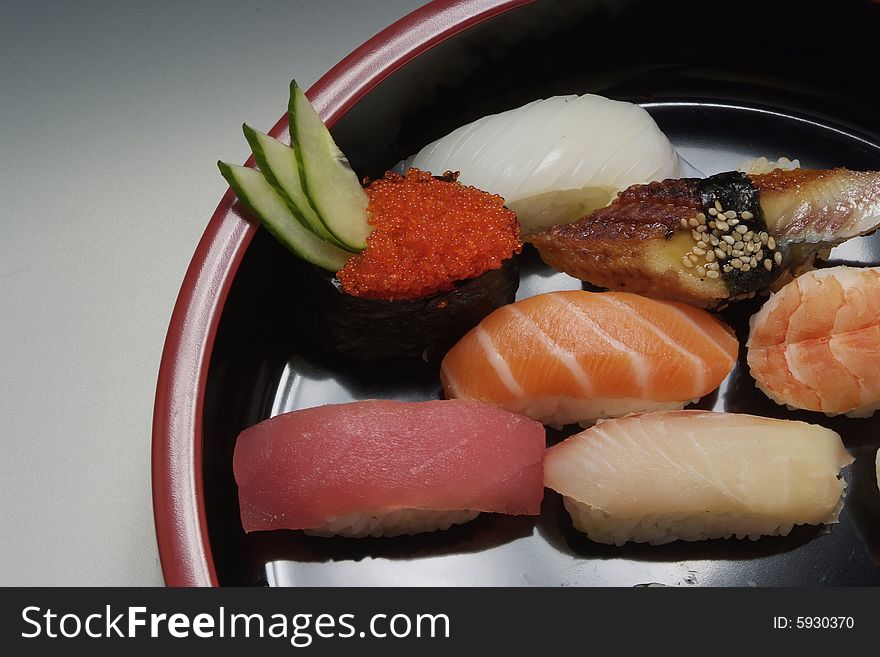 Sushi japanese food on ceramic round plate