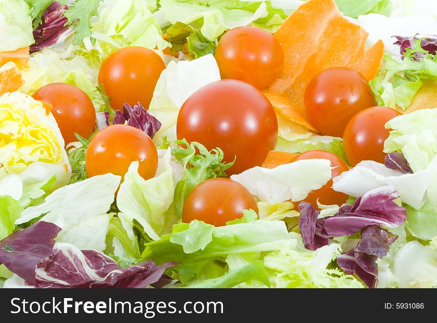 Green salad with tomatoes - healthy eating - vegetables - close up. Green salad with tomatoes - healthy eating - vegetables - close up