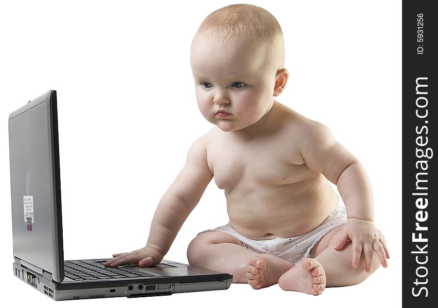 Baby Looking At Spread Sheet On Laptop.
