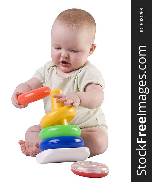 Baby girl playing with stacking rings. Baby girl playing with stacking rings.