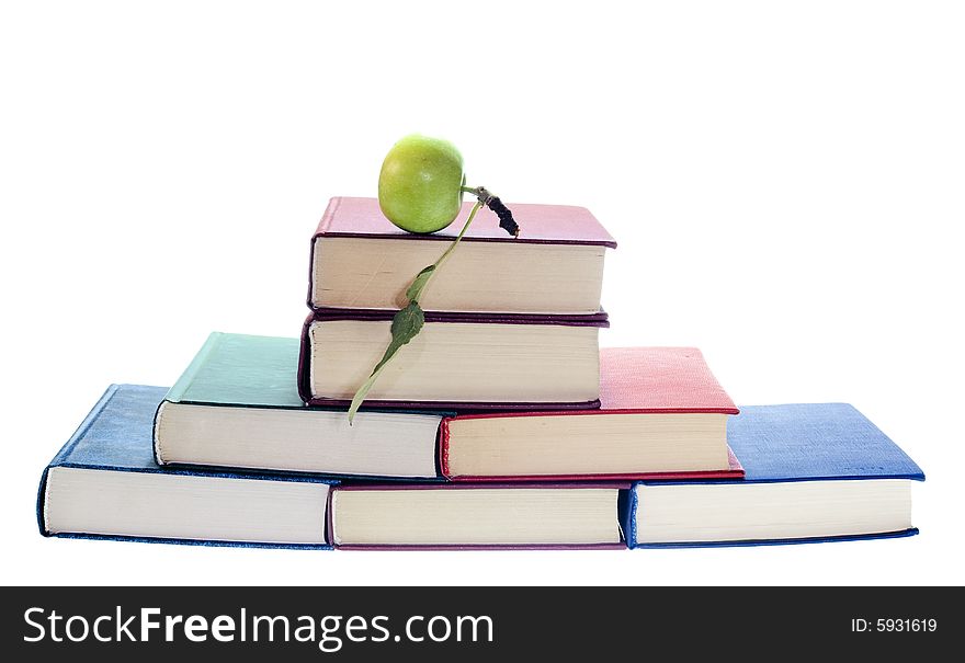 Apple on stack of books isolated on white background