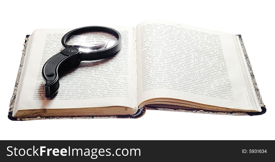 Magnifying Glass On Vintage Book. Magnifying Glass On Vintage Book.