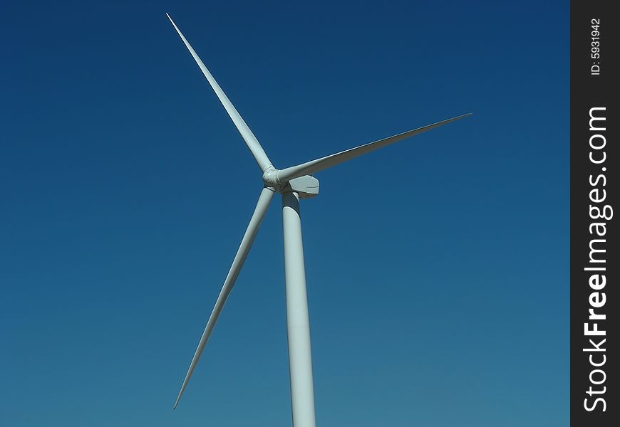 Closeup of the blades of a wind turbine.