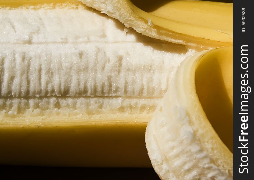 A closeup on a peeled banana. A closeup on a peeled banana.