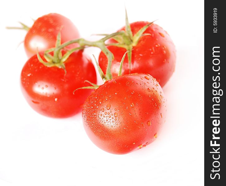 Cluster of red tomatoes isolated on white