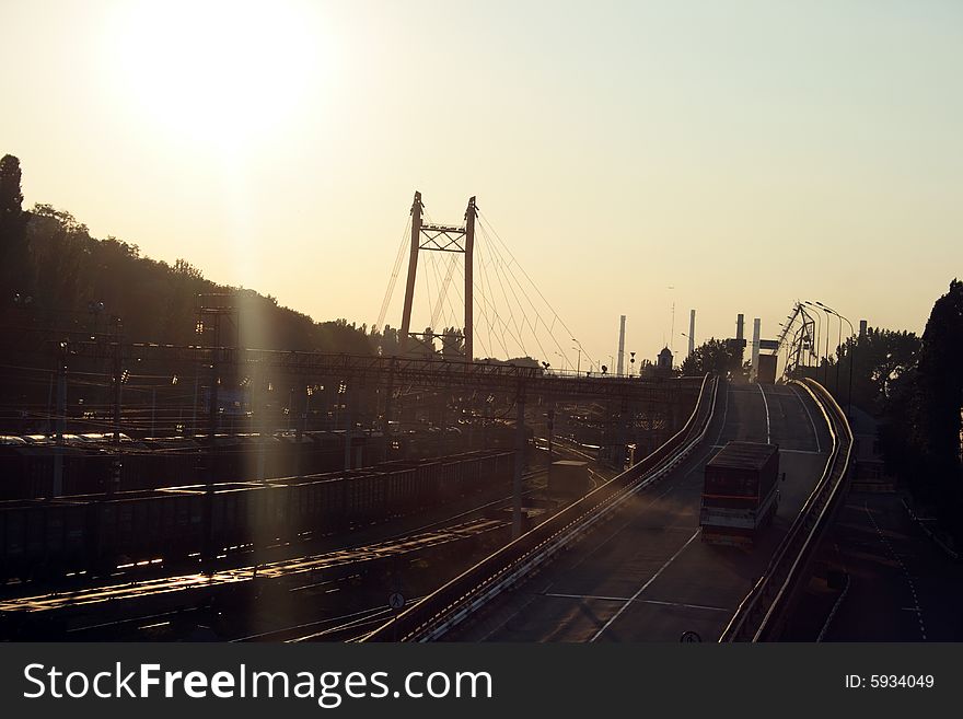 The bridge over the railway on the way to seaport of the city of Odessa, Ukraine, on a sunset