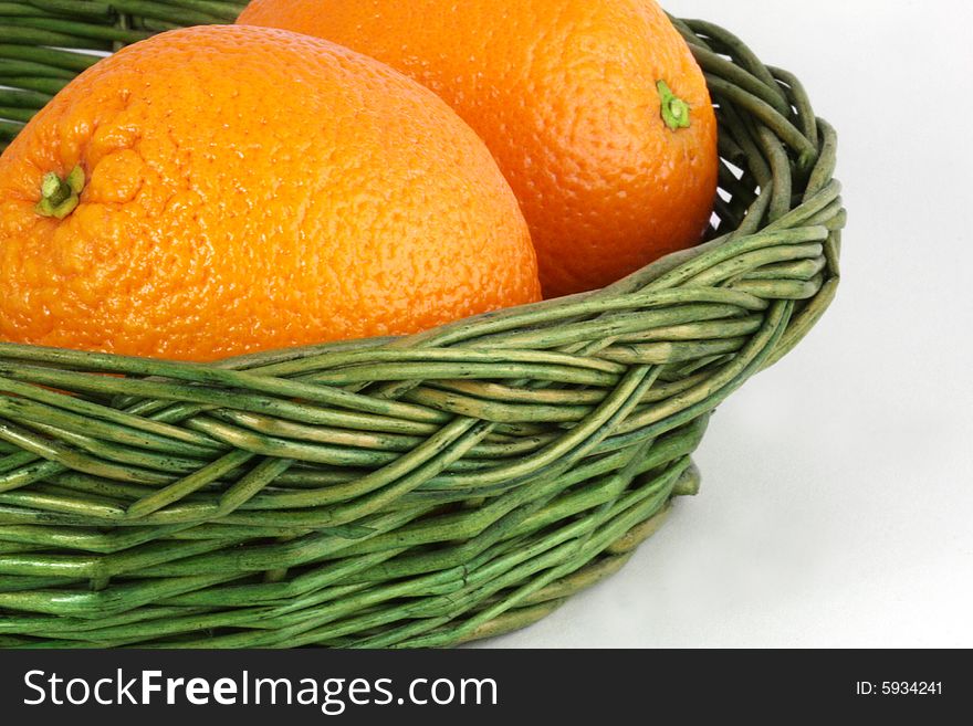 Ripe oranges in the wicker basket