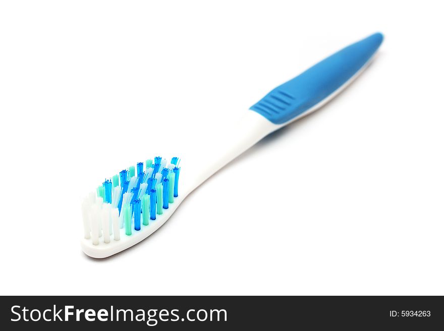 A blue white tooth brush on white background.