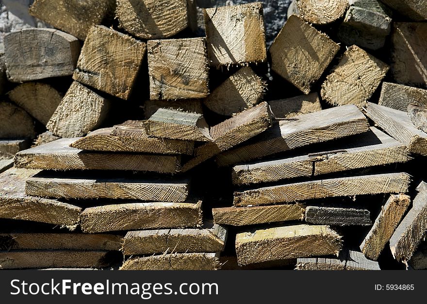 Chopped wood texture in sunny light