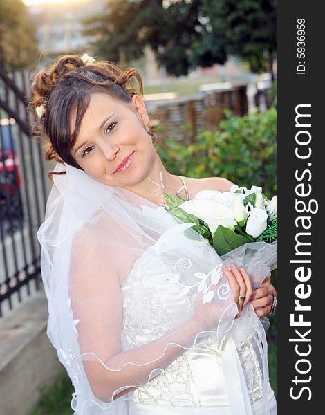 Beautiful happy bride standing outdoor. Beautiful happy bride standing outdoor