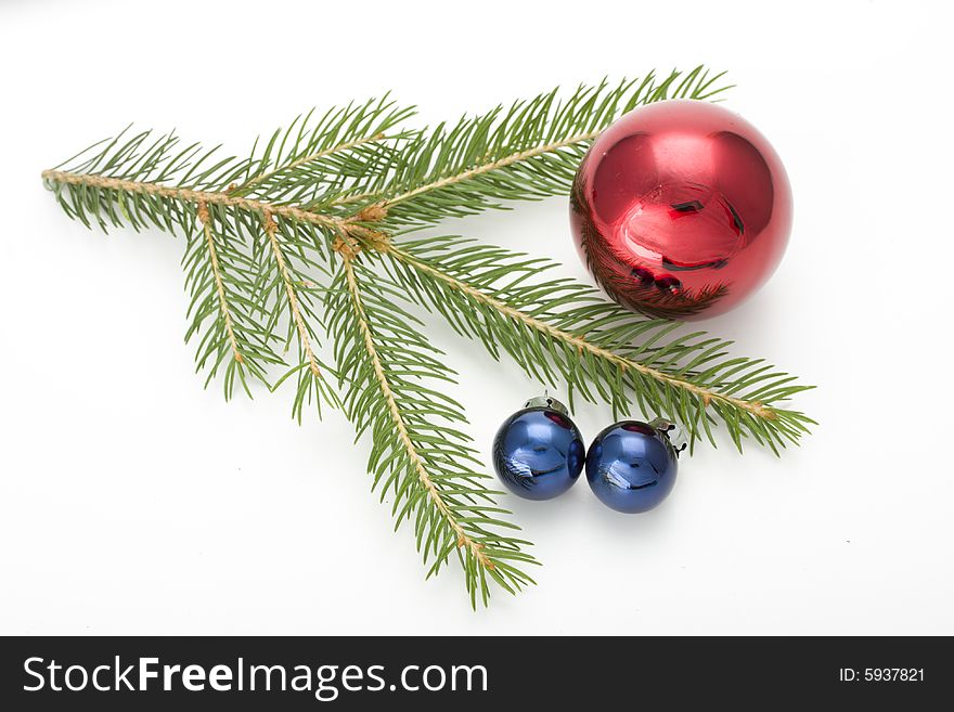 Spruce branch and christmas decoration on whitchristmas e background