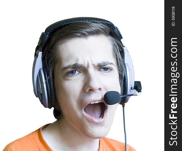 A young man in headphones with microphone on a white background. A young man in headphones with microphone on a white background.