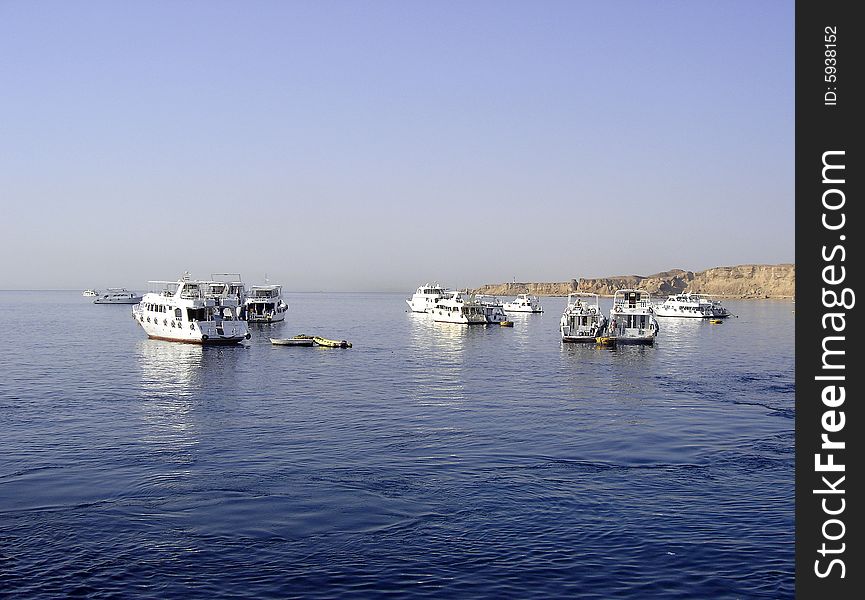 Scuba diving tour boats anchored in the Red Sea off Sharm el Sheikh, Egypt. Scuba diving tour boats anchored in the Red Sea off Sharm el Sheikh, Egypt.