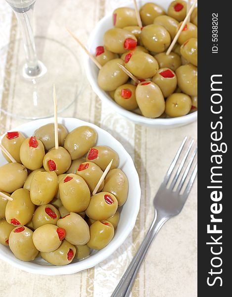 Green olives, stuffed with red peppers. Green olives, stuffed with red peppers