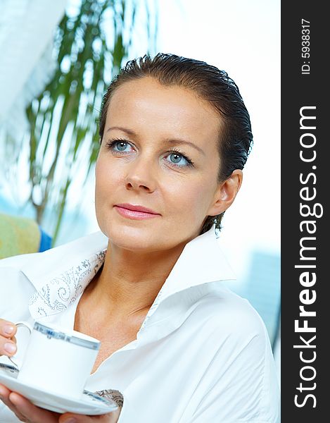 High key portrait of nice gorgeous woman drinking coffee. High key portrait of nice gorgeous woman drinking coffee