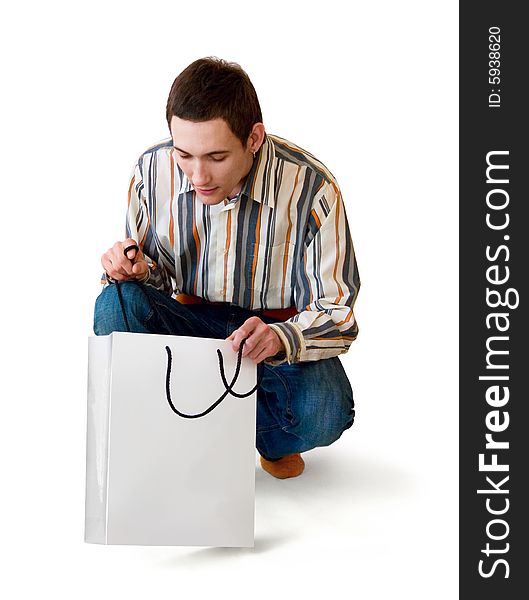 Man looks in gift package, on white background. Man looks in gift package, on white background