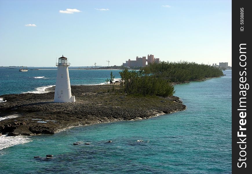 The view of narrow Paradise Island with a lighthouse in front of it (The Bahamas). The view of narrow Paradise Island with a lighthouse in front of it (The Bahamas).