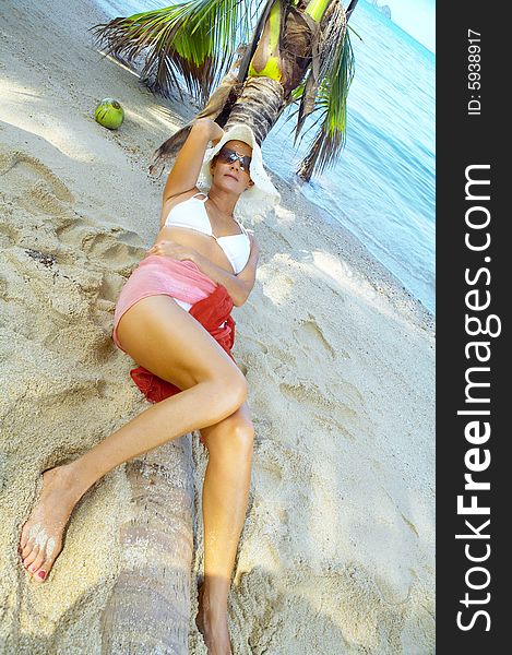 View of nice woman having fun on tropical beach. View of nice woman having fun on tropical beach