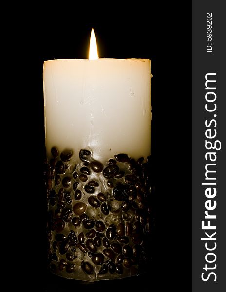 Candle isolated on black background