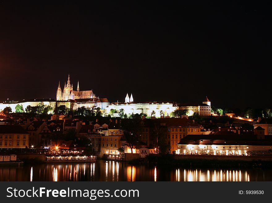 Beautiful night view at Prague, capital city of the Czech Republic with castle and roofs of Mala Strana