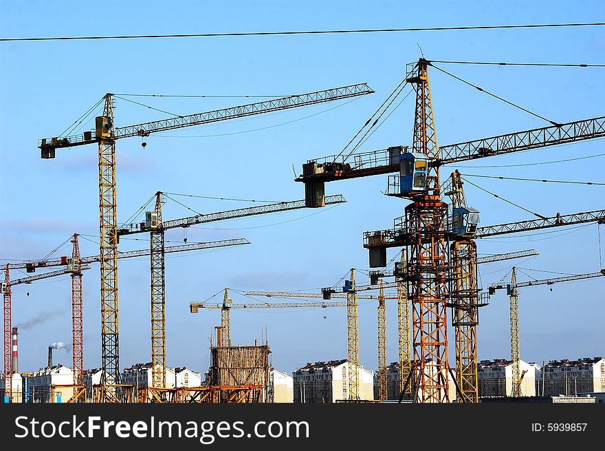 Construction cranes at building site