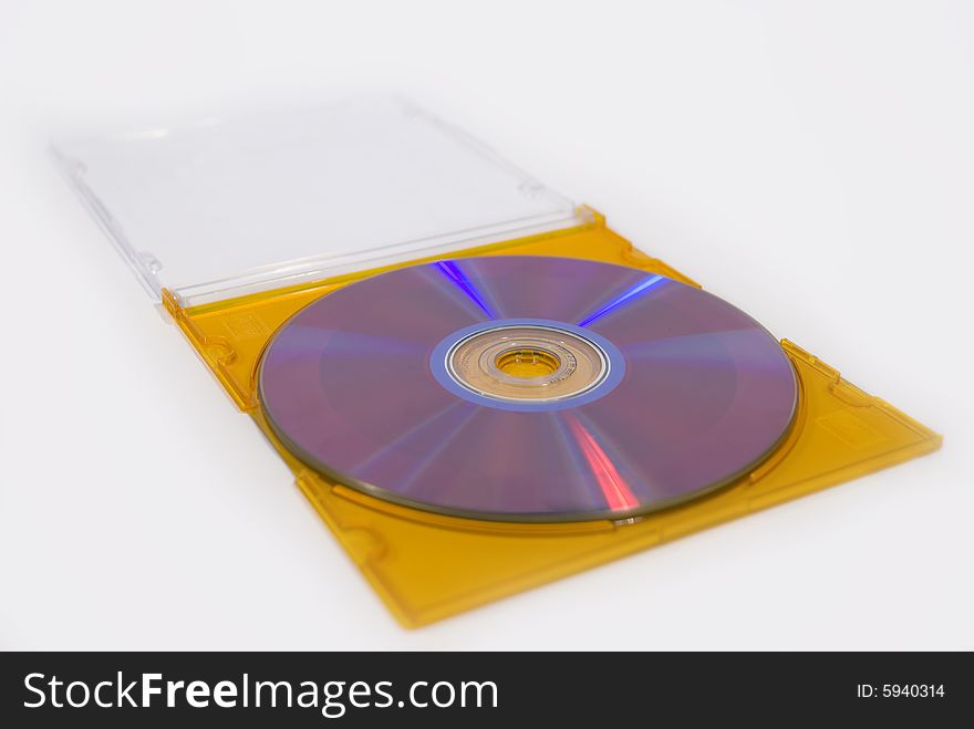 A blank compact disk in a yellow box isolated on a white background. A blank compact disk in a yellow box isolated on a white background.