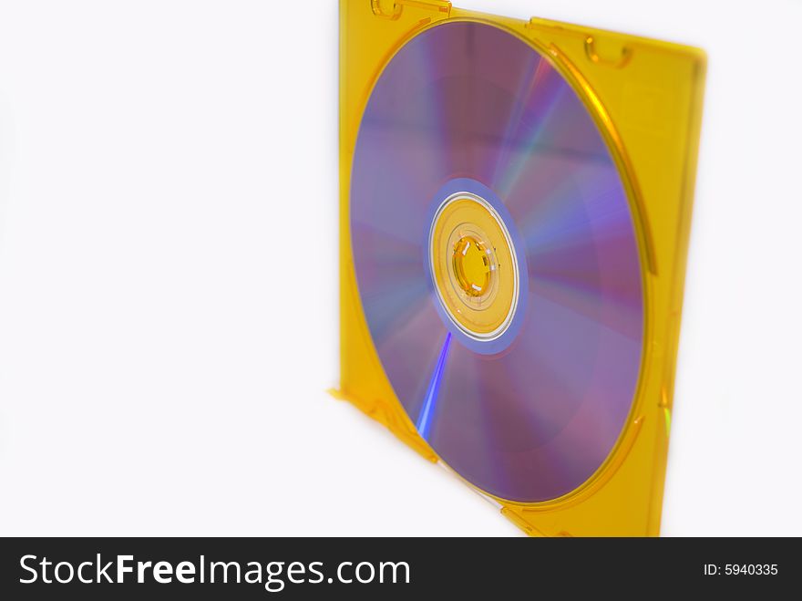 A blank compact disk in a yellow box isolated on a white background. A blank compact disk in a yellow box isolated on a white background.