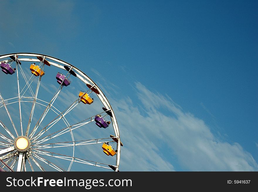 Top of a Ferris Wheel at an Amusement park.