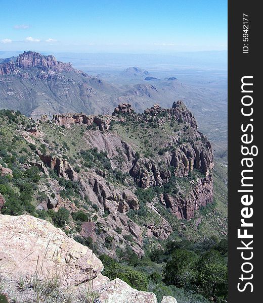 Desert mountain vista with cliffs and clouds