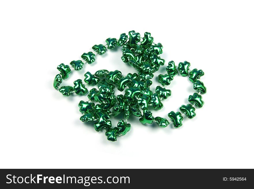 A photograph of clover beads against a white background. A photograph of clover beads against a white background