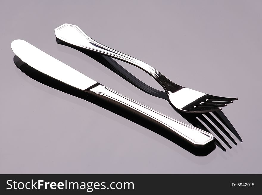 Cutlery in studio, dark background. Cutlery in studio, dark background