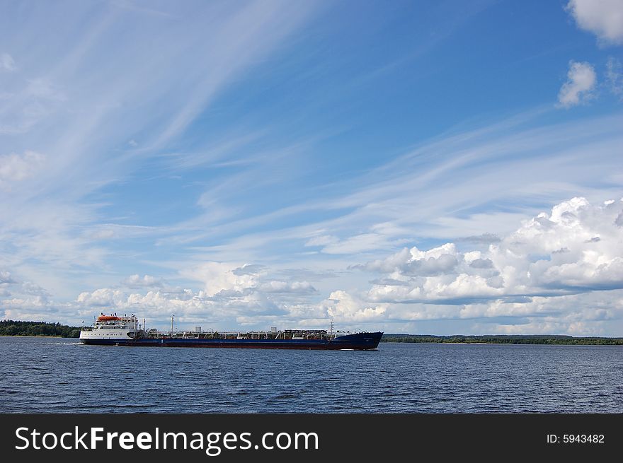 River cargo ship and blue sky