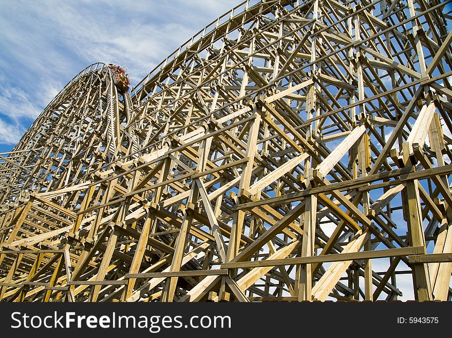Photo of a wooden roller coaster in a theme park