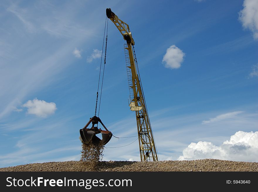 The port dredge unloads gravel