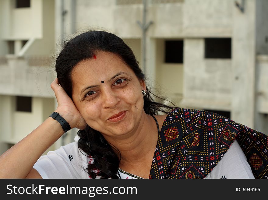 A modern Indian housewife in a fine and casual mood. A modern Indian housewife in a fine and casual mood.