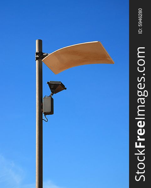 Modern lamppost with unusual diffuser against a background of blue sky. Modern lamppost with unusual diffuser against a background of blue sky