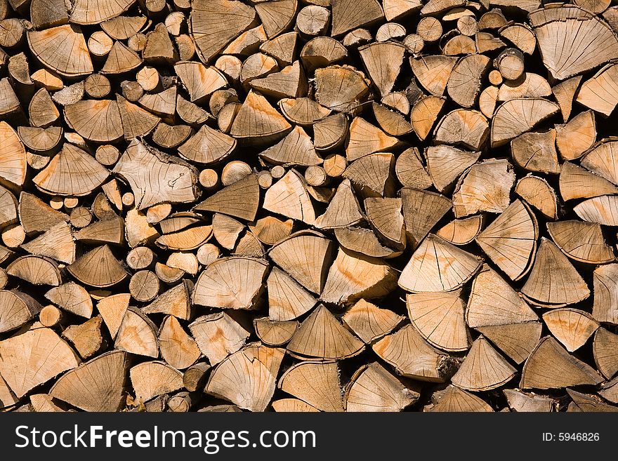 Stored wood chunks. Background texture.