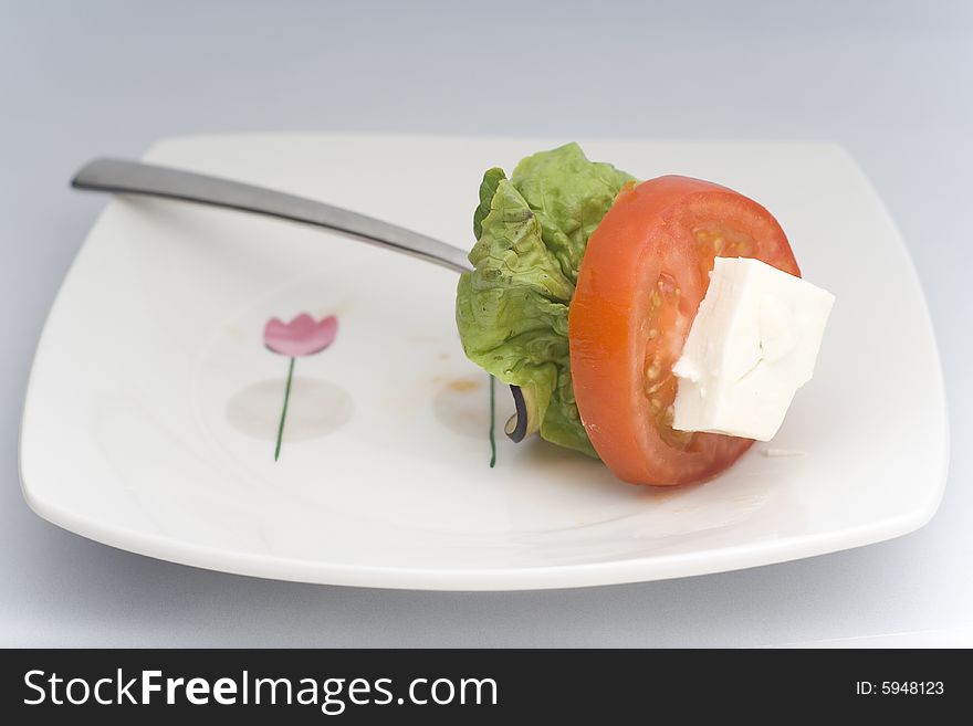 Lettuce, cheese, tomato, zucchini isolated on white background